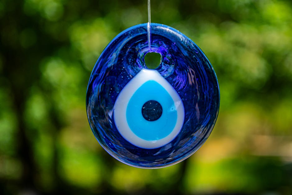 Cobalt blue evil eye nazar glass amulet bead in close-up macro photography