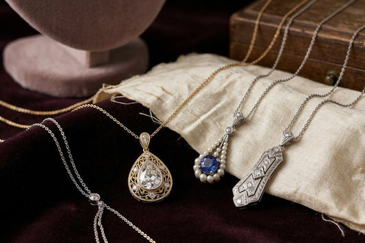 Sterling silver jewelry collection — necklaces and pendants — on a clean white surface
