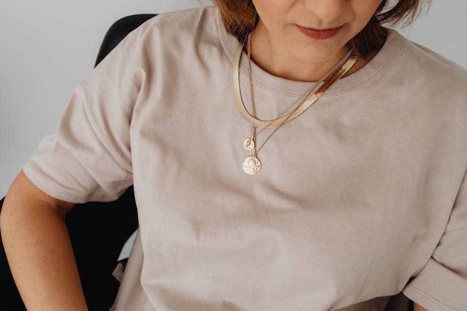 Layered gold necklaces styled in a flat lay — the minimalist stacking trend that defined 2026 jewelry