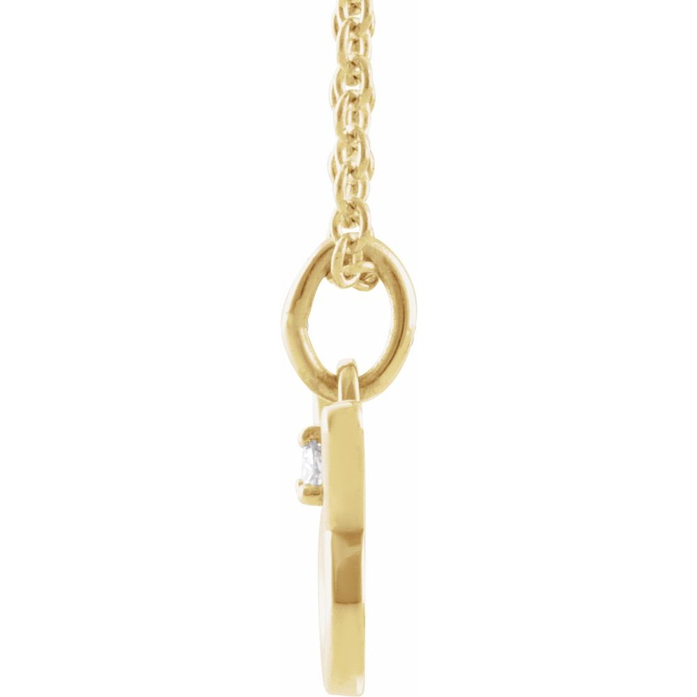  14K Solid Gold Taurus Zodiac Necklace featuring a natural diamond. Polished finish, adjustable 16-18 inches.  Side view.